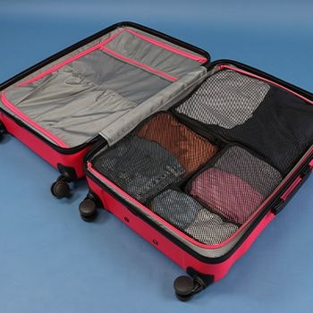 Explorer packing cubes in a hot pink explorer luna air suitcase