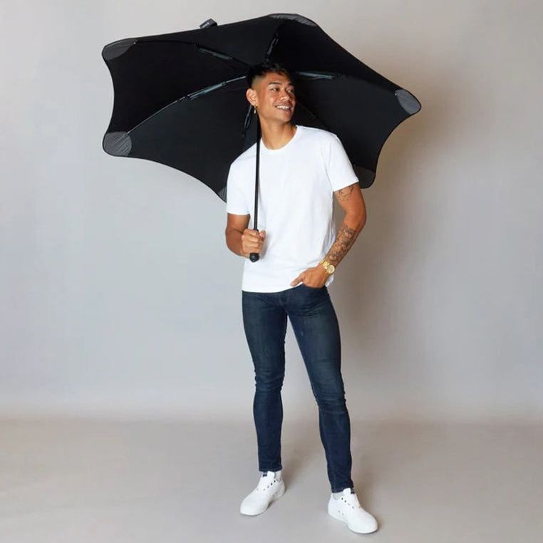 Happy man holding a Exec umbrella