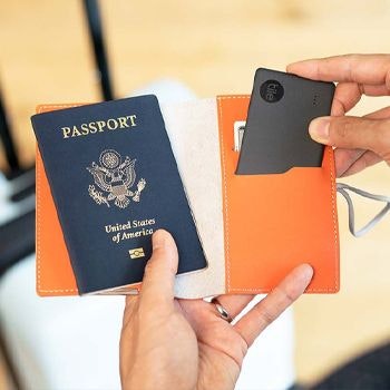 Tile Slim Tracker slotting into a passport holder