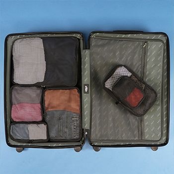Arlo suitcase filled with explorer packing cubes