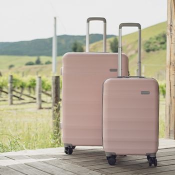 Dusty Pink Luna-Air 2 Suitcases in the countryside