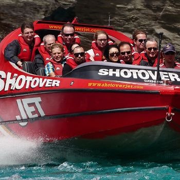 Group of people on the shotover jet, wearing life jackets_