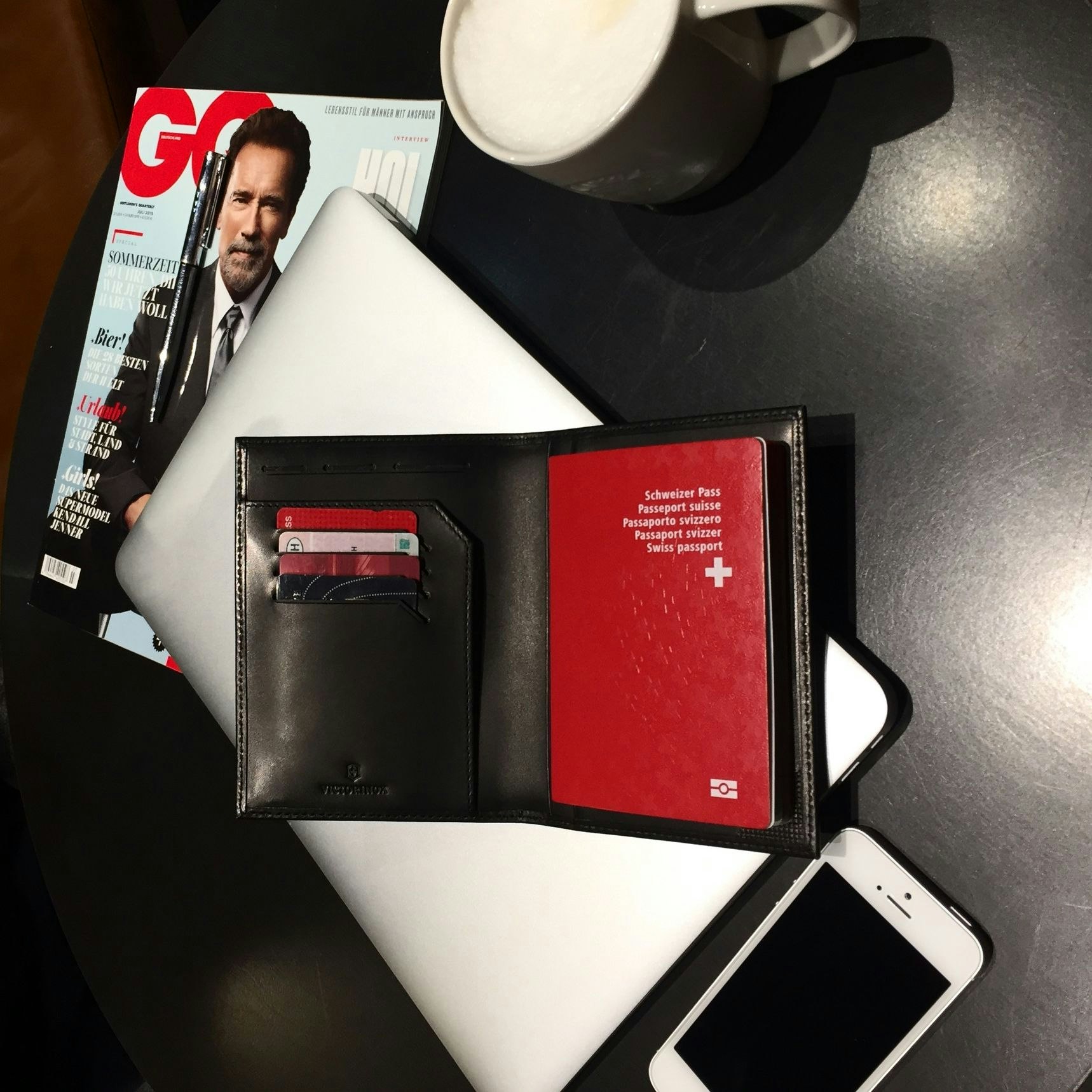 Swiss Passport with iPhone and coffee