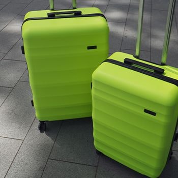 Explorer Luna Air 2 Suitcases in Neon Lime on the pavement