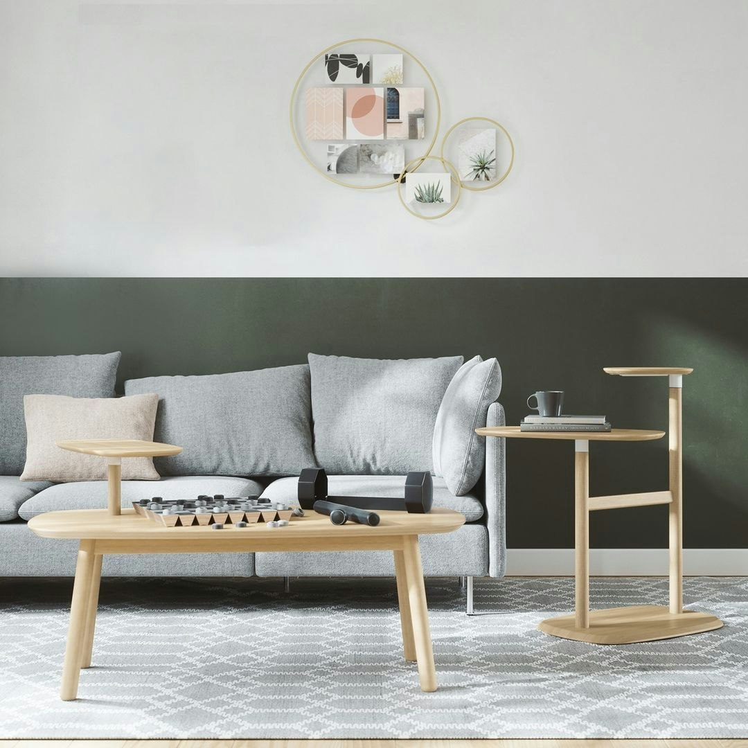living space with wall photo frames, coffee table and side table