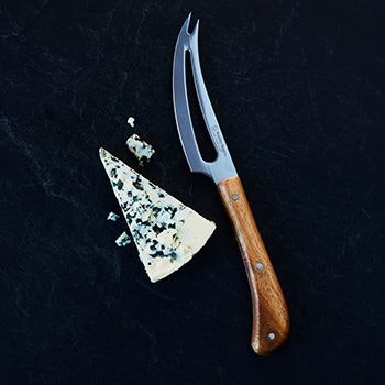 Stanley Rogers Cheese knife with a triangle of cheese next to it