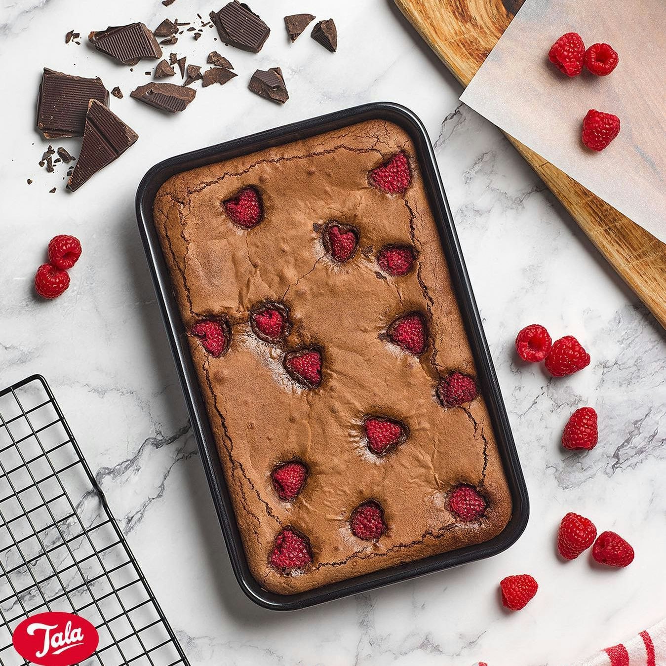 loaf tin with chocolate brownie and raspberries 