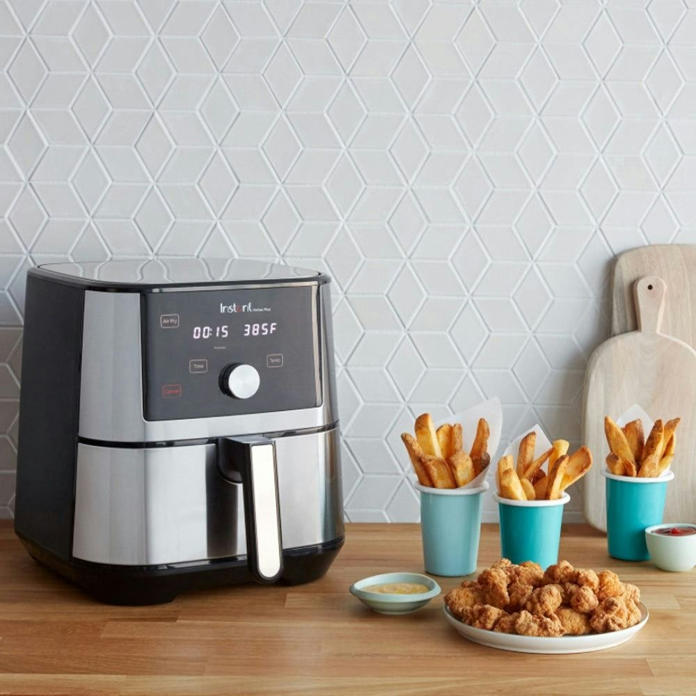 Instant Pot 5.7L Vortex Plus Air Fryer with chips and chicken next to it