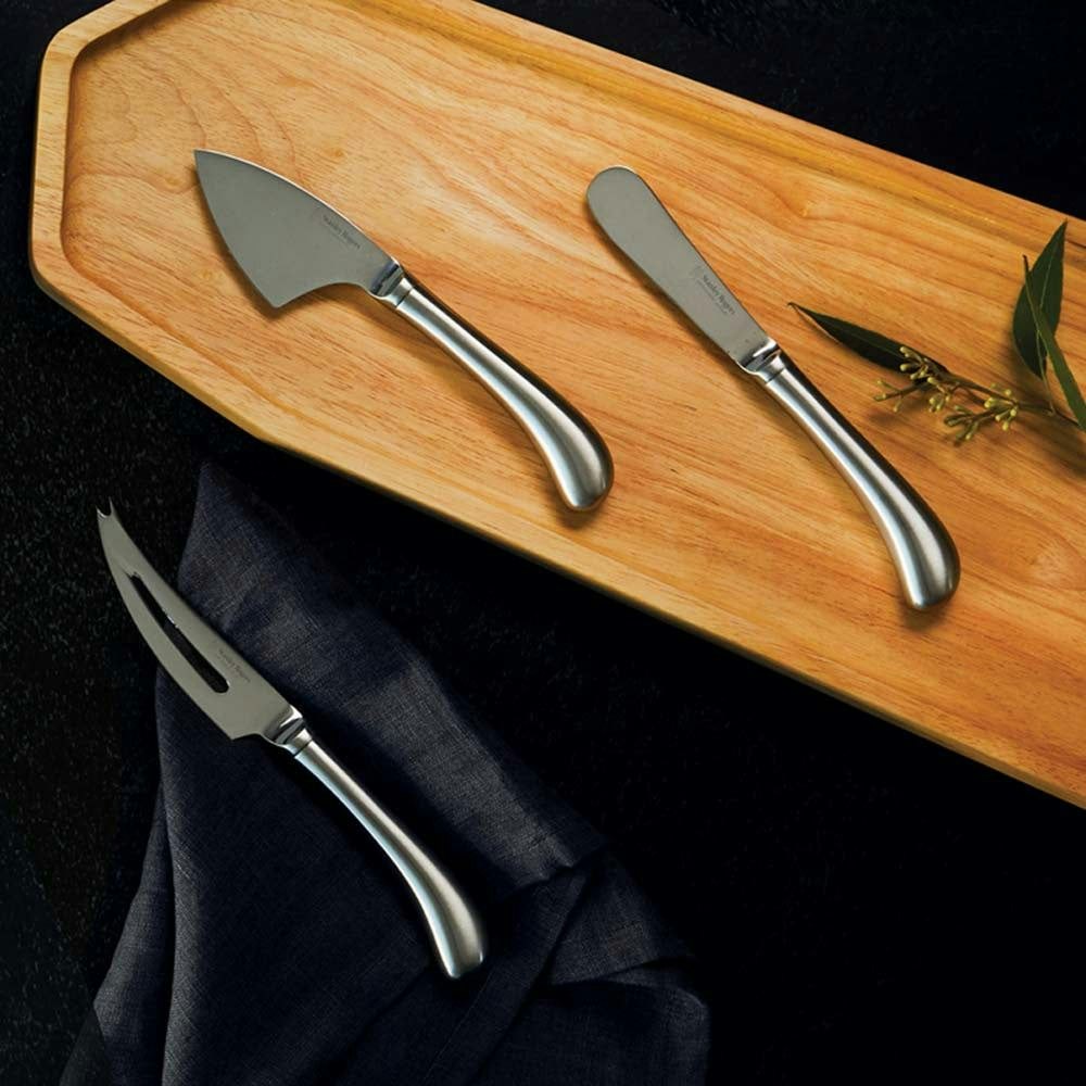 Stanley Rogers Cheese knife with a triangle of cheese next to it