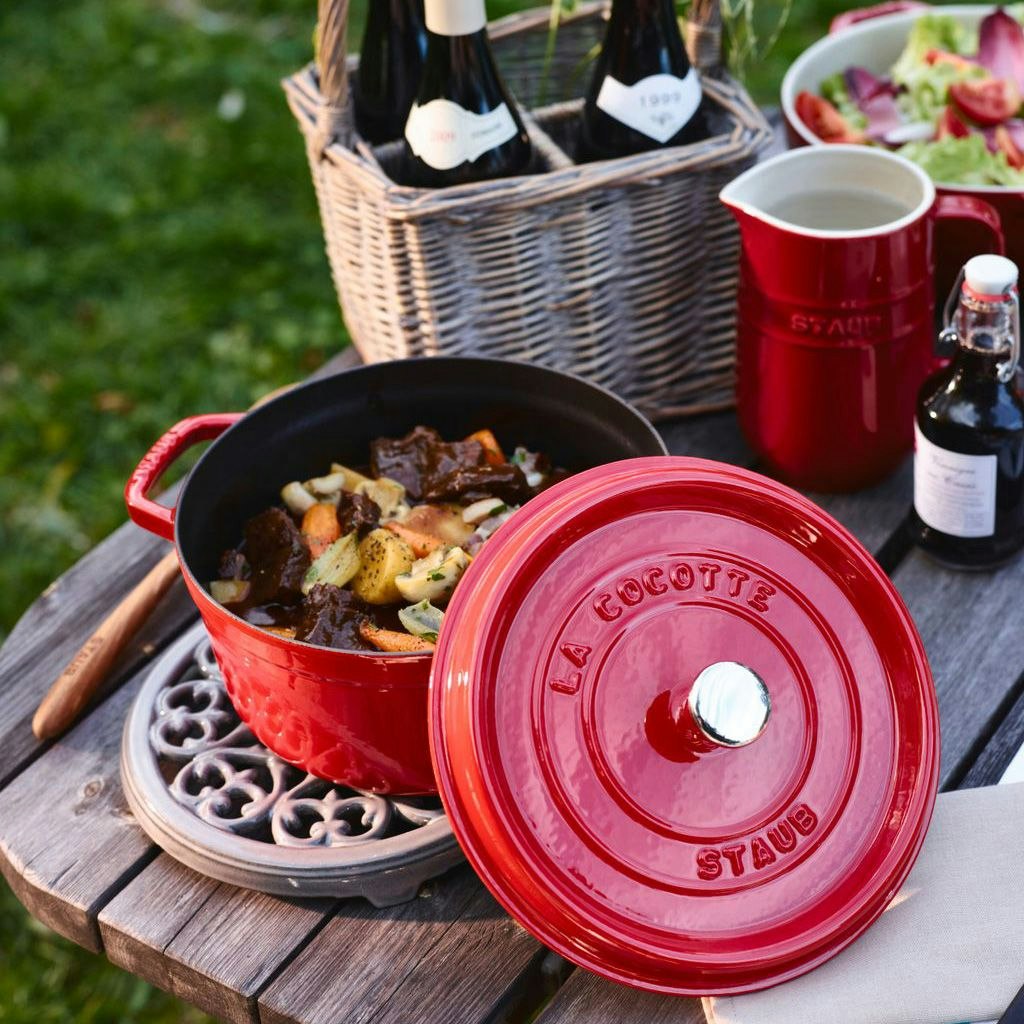 Staub cocotte colour red at a outdoor picnic