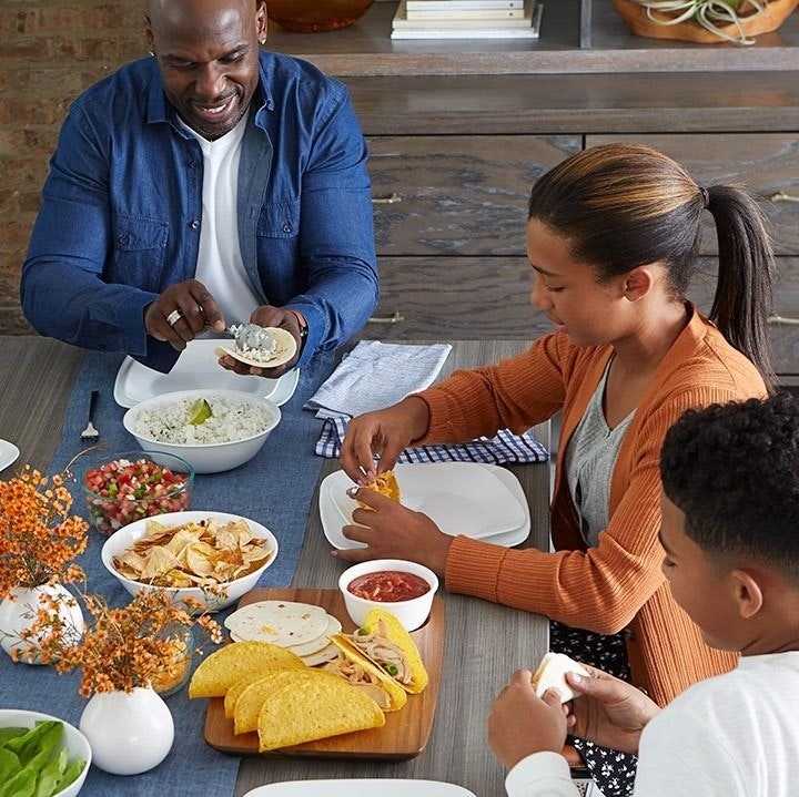 family eating dinner with Corelle Dinnerware
