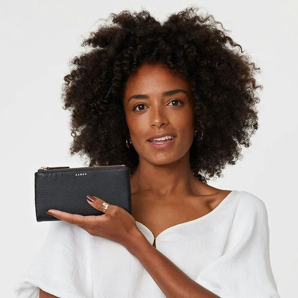 Woman posing with the Saben Sam Wallet