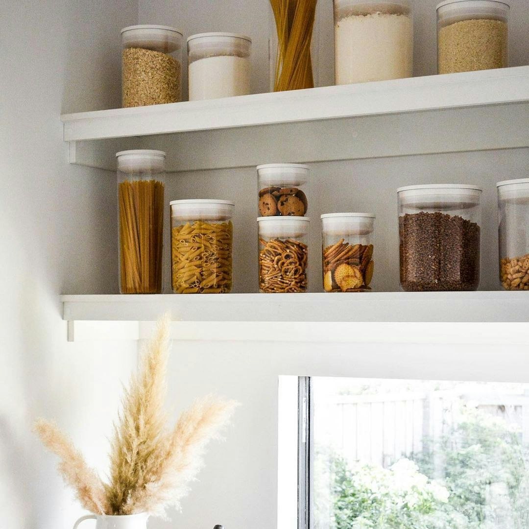 clear cylinder containers organised on shelf
